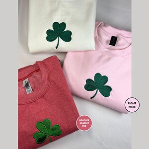 three t - shirts with green shamrocks on them