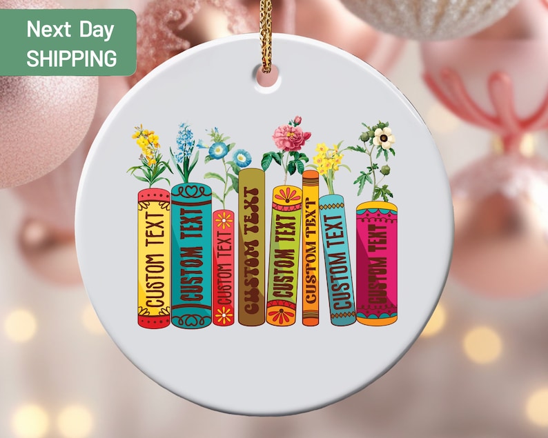 a christmas ornament with books and flowers on it
