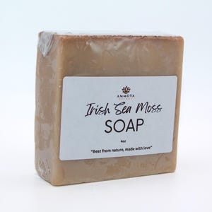 May include: A bar of light brown Irish Sea Moss soap with a white label that reads "AMMOTA Naturals Irish Sea Moss SOAP 4oz "Best from nature, made with love""