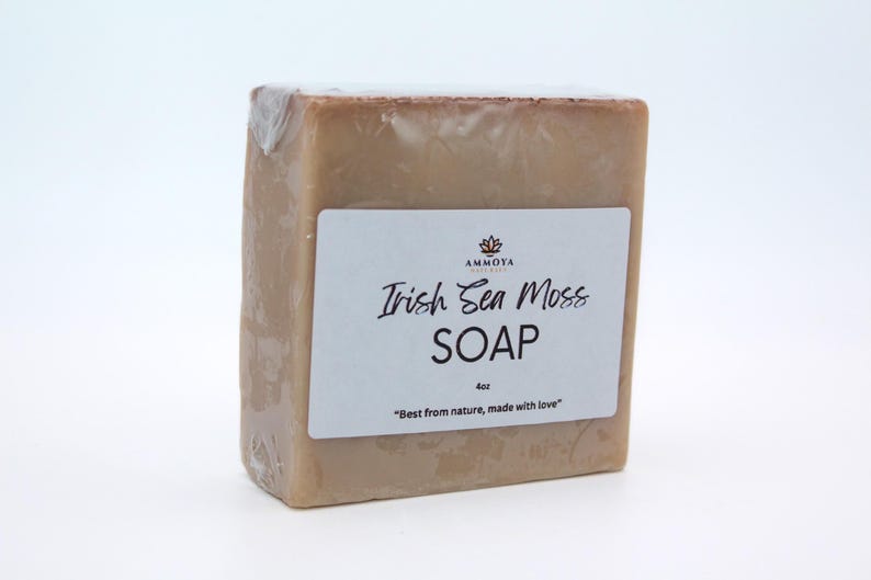 May include: A bar of light brown Irish Sea Moss soap with a white label that reads "AMMOTA Naturals Irish Sea Moss SOAP 4oz "Best from nature, made with love""