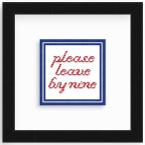 May include: A framed cross-stitch with a blue and white border. The text in red reads "please leave by nine".