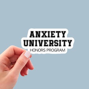 May include: White sticker with black text that reads "Anxiety University Honors Program".