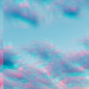 May include: A vibrant sky with pink and blue clouds. The clouds are fluffy and spread across the entire sky.