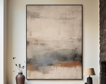 May include: Abstract painting with a white background and brown, blue, and gray accents. The painting is framed in black and hangs on a white wall above a wooden shelf.