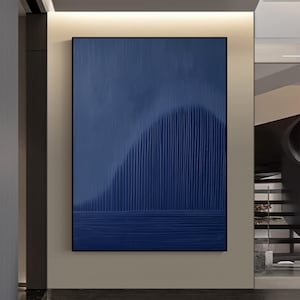 May include: Abstract painting with a blue background and a textured, vertical pattern. The pattern creates a wave-like shape in the center of the painting.