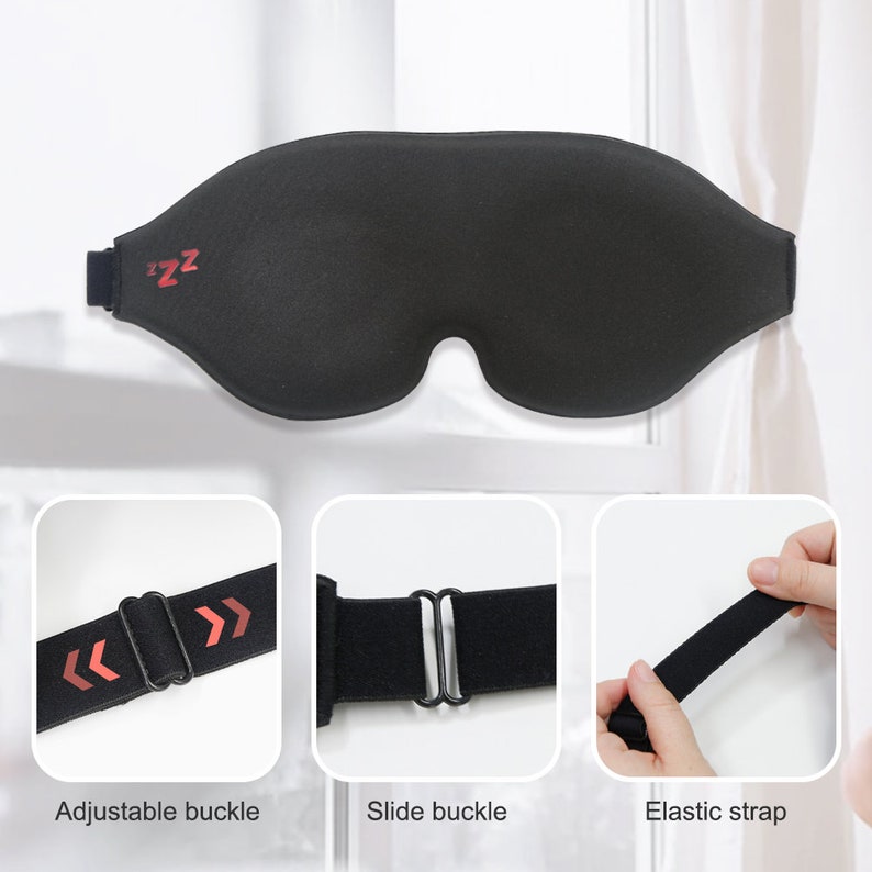 Op de afbeelding: Zwarte slaapmasker met verstelbare banden en een 'zzz'-logo. Het masker is gemaakt van zacht, comfortabel materiaal en is ontworpen om licht te blokkeren.