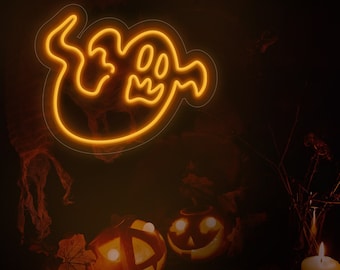 May include: Two carved pumpkins with lit candles inside, a glowing neon ghost sign, and a lit candle on a dark background with dried branches.