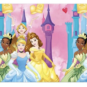 May include: A repeating pattern featuring animated princesses including Tiana, Cinderella, Belle, and Rapunzel against a pink background with a purple castle, yellow floating lanterns, and small red hearts. The characters wear their iconic gowns.