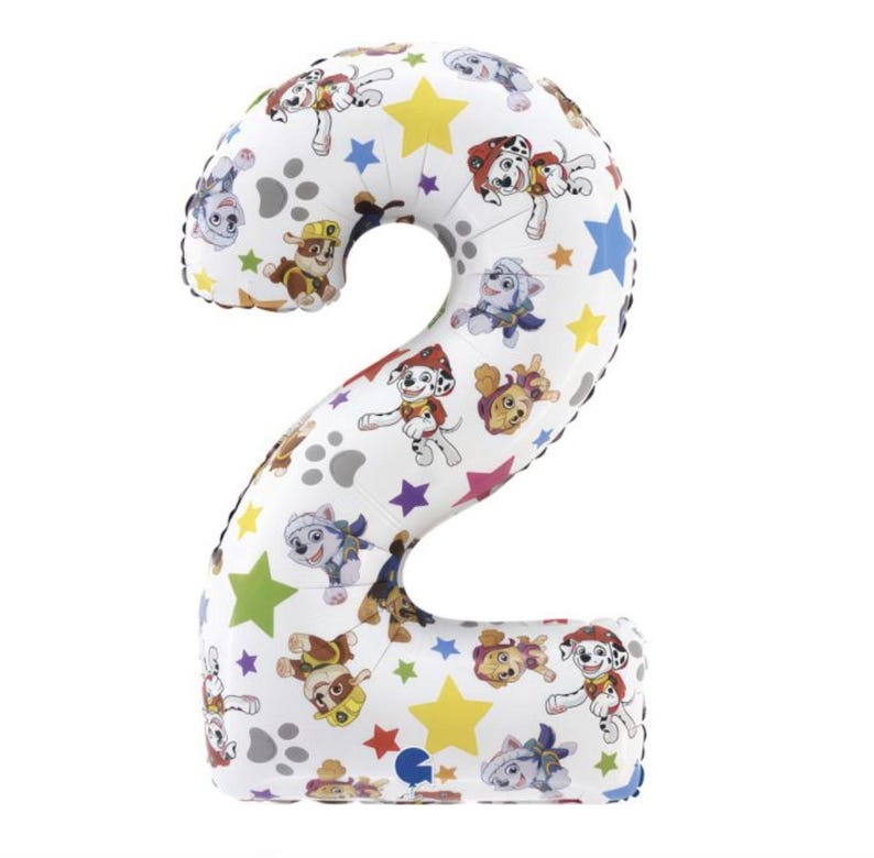 May include: A white number two balloon with a colorful Paw Patrol design. The balloon features images of the Paw Patrol characters, paw prints, and colorful stars. The balloon is designed for a birthday celebration.