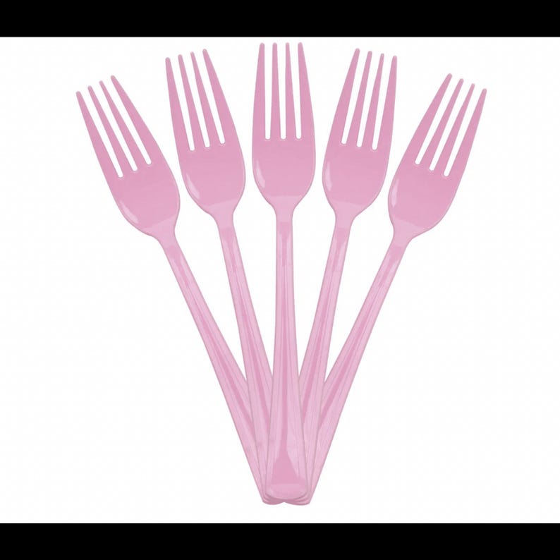 May include: Five light pink plastic forks arranged in a fan shape. Each fork features four tines and a smooth, solid handle. The forks are identical in design and color, positioned with the handles meeting at the bottom and tines fanned outward.