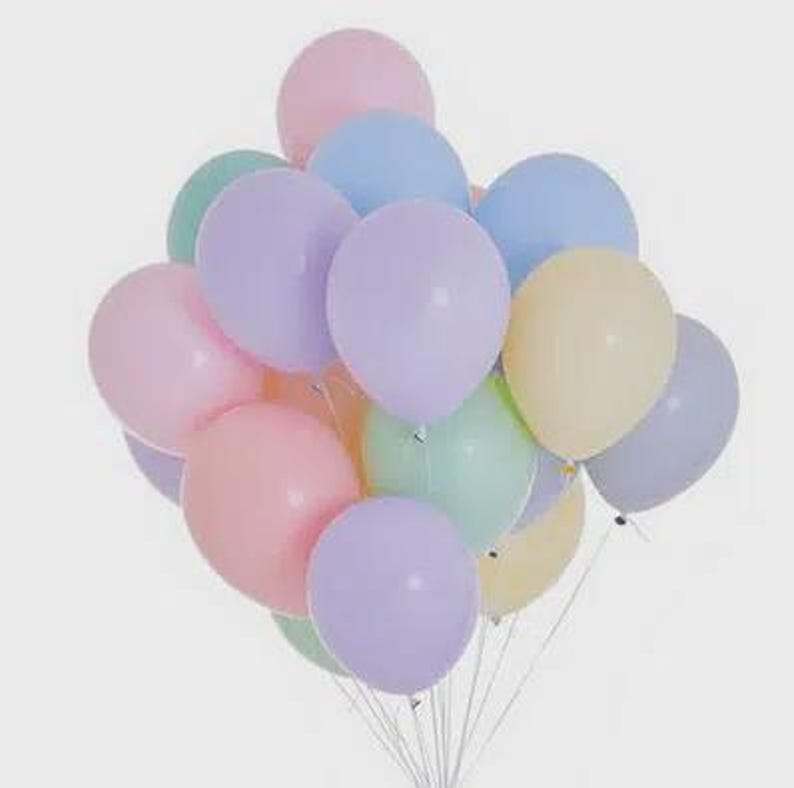 May include: A cluster of round latex balloons in various pastel colors including light pink, lavender, baby blue, mint green, and pale yellow. Each balloon is inflated to a rounded shape and attached to a thin white string at the bottom.