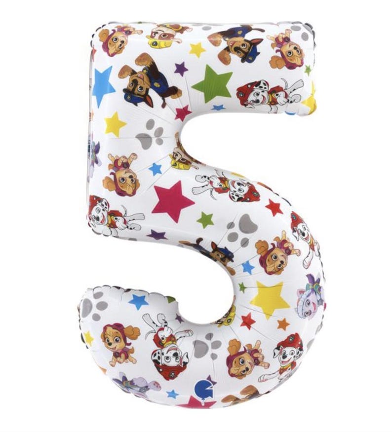 May include: White number 5 foil balloon featuring Paw Patrol characters, colorful stars, and paw prints. The balloon is designed for a birthday celebration or party.