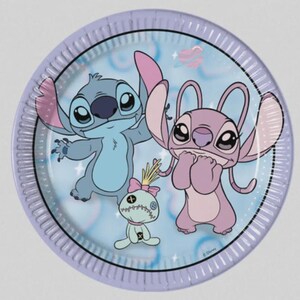 May include: A round paper plate with a light blue background featuring a graphic print of the blue character Stitch, the pink character Angel, and a small doll with a pink bow. The plate has a light purple rim and includes a small planet icon.