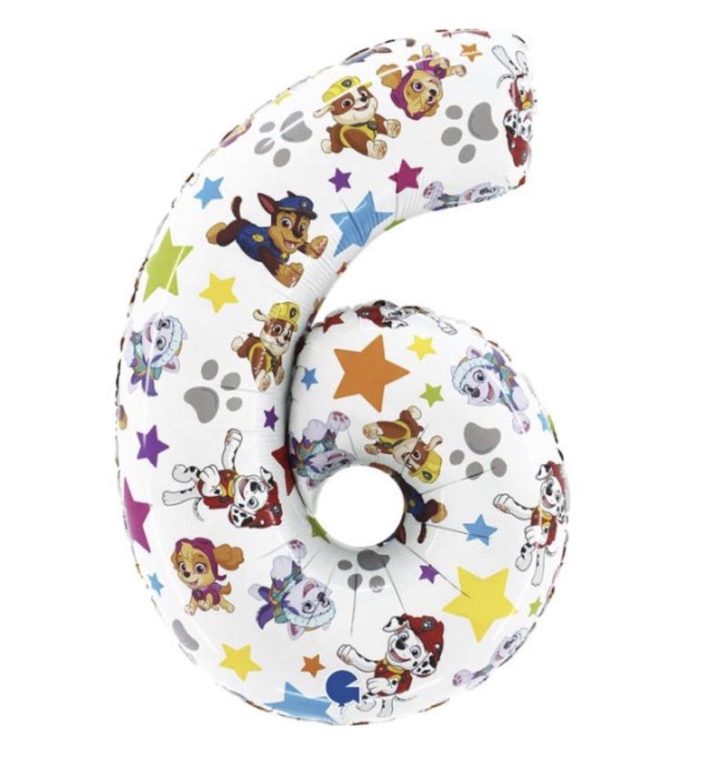 May include: White number six-shaped balloon featuring colorful Paw Patrol characters, paw prints, and stars. The balloon is designed for a birthday celebration or party. The balloon is made of a shiny, reflective material.