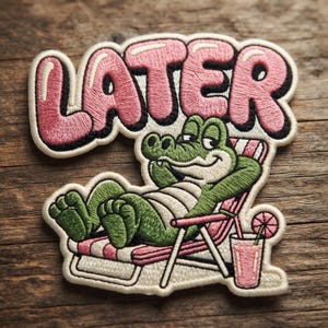May include: An embroidered patch featuring a green alligator lounging in a pink and white striped beach chair. The word LATER is stitched in large pink letters with black outlines above the alligator, who is next to a pink drink with a slice of fruit.