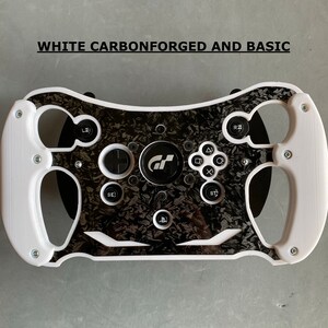 May include: White racing steering wheel with black carbon fiber accents and buttons. The steering wheel has a PlayStation logo and the text "GT" in the center.