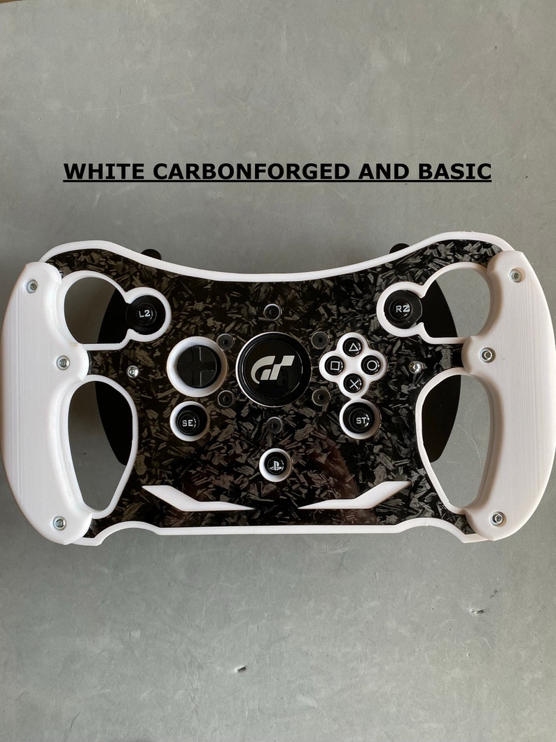 May include: White racing steering wheel with black carbon fiber accents and buttons. The steering wheel has a PlayStation logo and the text "GT" in the center.