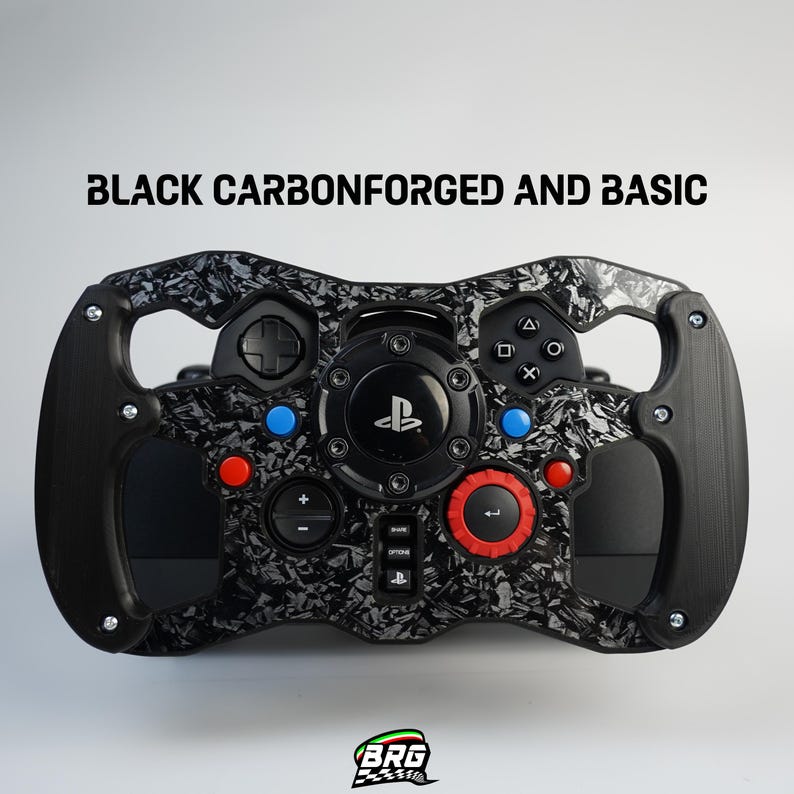 May include: Black and gray carbon fiber-patterned racing wheel with black accents and colored buttons. The wheel has a PlayStation logo in the center and the text "BLACK CARBONFORGED AND BASIC" at the top.