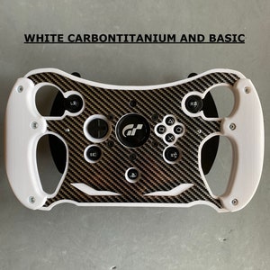 May include: White steering wheel with a carbon fiber design and black buttons. The steering wheel has a GT logo in the center.