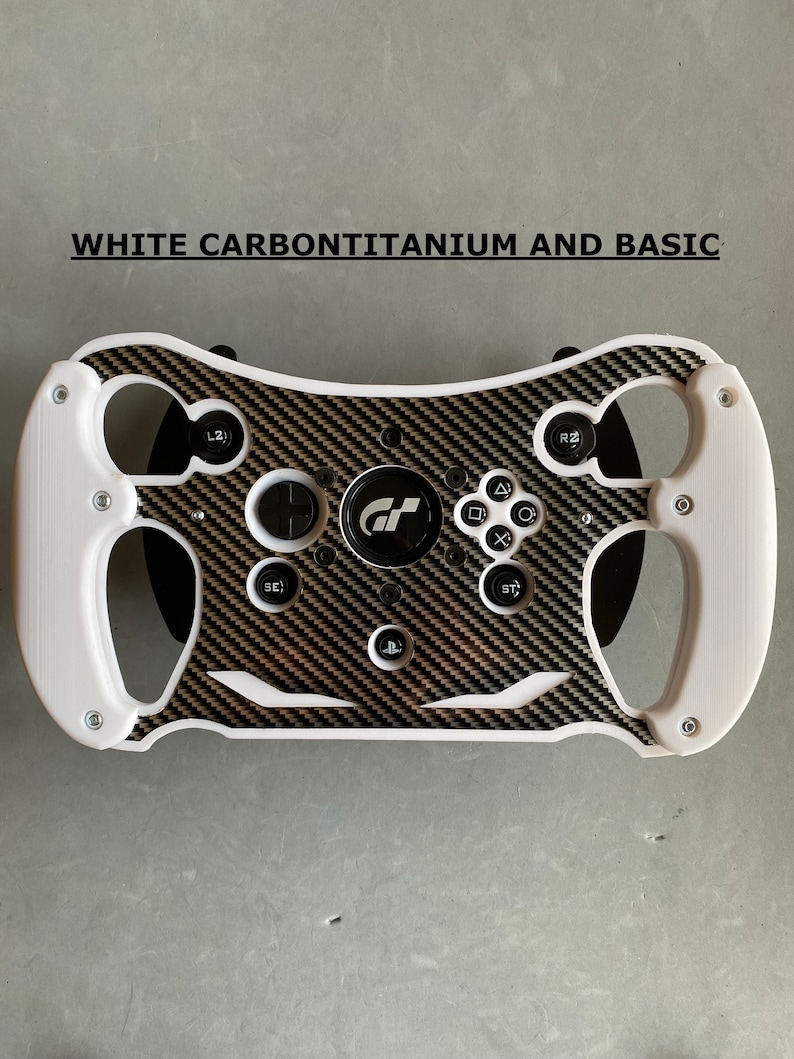 May include: White steering wheel with a carbon fiber design and black buttons. The steering wheel has a GT logo in the center.