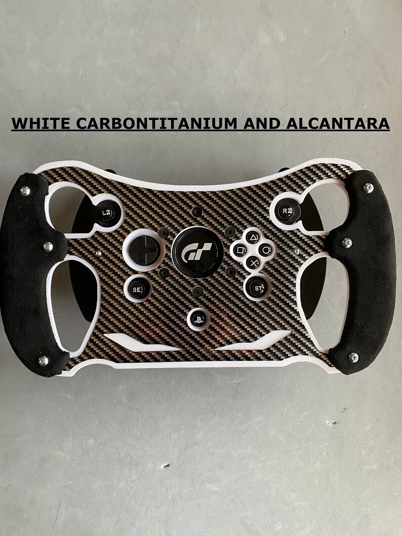 May include: White racing steering wheel with a carbon fiber and alcantara design. The steering wheel has a black suede grip and features buttons for various functions, including a PlayStation logo.