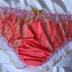 Light red glossy satin ruffle pants, men’s lingerie.
