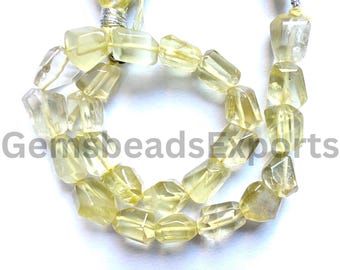May include: Strand of faceted, light yellow gemstone beads. The beads are irregular in shape and appear translucent. A yellow tassel is attached to the top of the strand. The text "GemsbeadsExports" is visible in the image.
