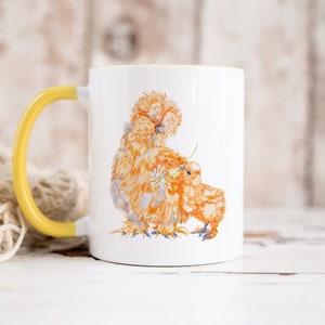 Silkie Chicken Mom and Chick Mug with a choice of coloured handles - pink, yellow or blue! A buff chick gifting a flower to it’s silkie mama