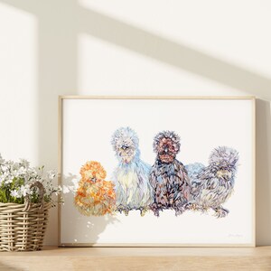 A print of four beautiful silkie chickens painted in watercolour. There are birds of four different colours sitting in a row. The print is next to a basket little white flowers.