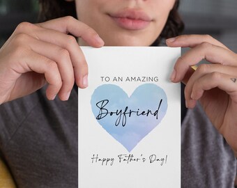 May include: A white card with a blue watercolor heart that says "To an amazing Boyfriend! Happy Father's Day!"