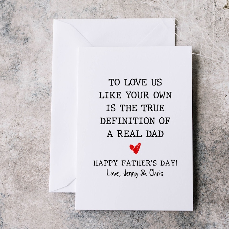 May include: A white card with black text that reads "To love us like your own is the true definition of a real dad."  A red heart is drawn below the text. The card also says "Happy Father's Day! Love, Jenny & Chris".