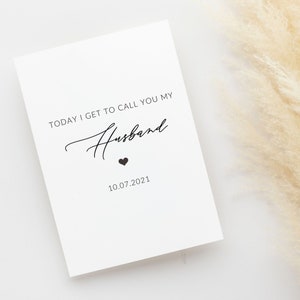 May include: A white card with black text that reads "Today I get to call you my Husband" with a small black heart and the date "10.07.2021" printed below.