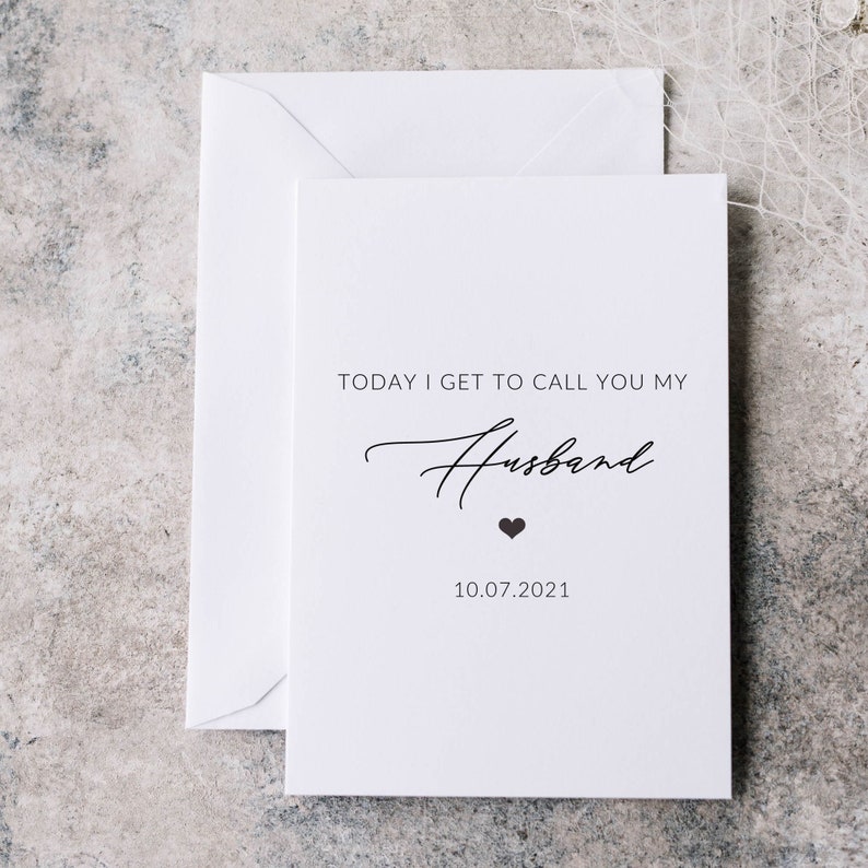 May include: White card with black text that reads "Today I get to call you my Husband" with a small black heart and the date "10.07.2021".