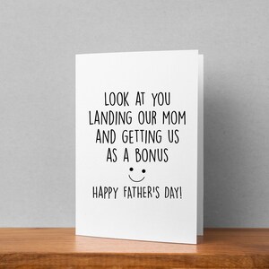 May include: A white card with black text that reads "Look at you landing our mom and getting us as a bonus. Happy Father's Day!"