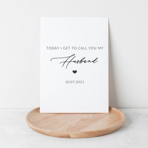 May include: White printable sign with black text that reads "Today I get to call you my Husband" with a small black heart and the date "10.07.2021" below.