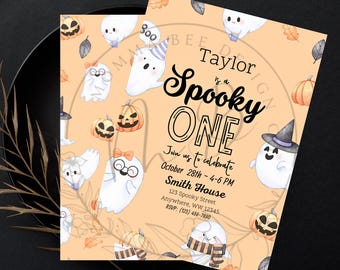 May include: A Halloween-themed first birthday party invitation with a cute ghost illustration and the text "Taylor is a Spooky One". The invitation includes details about the party, including the date, time, and location.