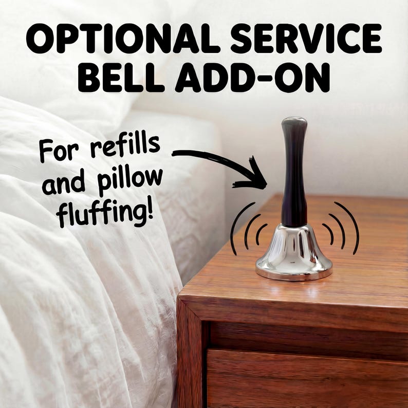 Optional silver service bell beside a bed with the message “For refills and pillow fluffing.”