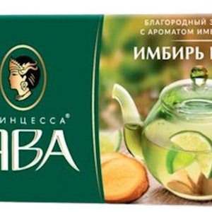 May include: A box of Princess Java green tea with ginger and lime flavor. The box features a green background with a woman's face in the upper left corner and the text "Princess Java" in large, bold letters. The box also features a teapot filled with green tea, ginger, and lime slices. The text "Благородный зеленый чай с ароматом имбиря и лайма" is printed on the box in Russian.