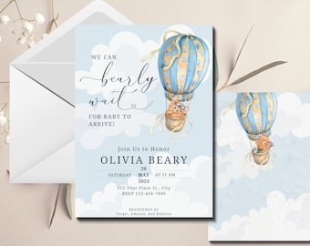 May include: A baby shower invitation with a blue and yellow hot air balloon with a teddy bear inside. The text reads "We can barely wait for baby to arrive!" and "Join us to honor Olivia Beary Saturday, May 20, 2023 at 11 AM. 123 That Place St., City. RSVP 123-456-7890. Registered at Target, Amazon, and Babylist."