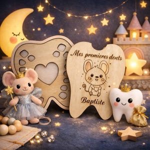 May include: Wooden tooth-shaped keepsake box with a heart cutout, a plush mouse wearing a crown and holding a star wand, and a smiling tooth figurine. The box has the text "Mes premieres dents" and the name "Baptiste".