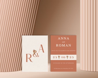 Puede incluir: Dos tarjetas de invitación de boda rectangulares. La tarjeta izquierda es crema con letras grandes en terracota R & A con un pequeño ramo floral. La tarjeta derecha es terracota con texto blanco: ANNA and ROMAN, INVITE YOU TO CELEBRATE OUR WEDDING, 25 10 25, 3 O'CLOCK IN THE AFTERNOON y 524 Rockaway Ave, Brooklyn, NY 11212.