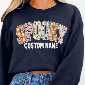 Personalized Spooky Custom Name T-Shirt | Retro Halloween Ghost Bat Spider Patchwork Groovy Fall Sweatshirt