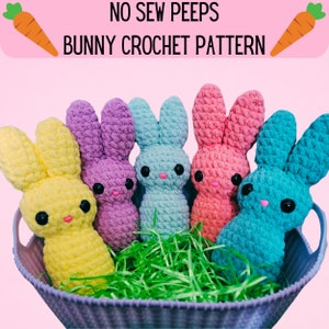 May include: A basket filled with five colorful crochet bunnies in yellow, purple, light blue, pink, and teal. The bunnies have black eyes and pink noses. The text "NO SEW PEEPS BUNNY CROCHET PATTERN" is at the top of the image, with carrot illustrations on each side.