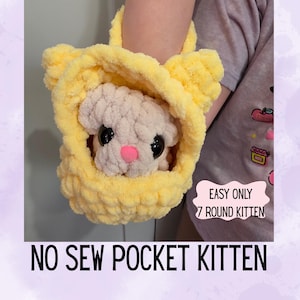 May include: A handmade yellow crochet pocket kitten with a fluffy white kitten inside. The kitten has black eyes and a pink nose. The text on the image reads "EASY ONLY 7 ROUND KITTEN" and "NO SEW POCKET KITTEN".