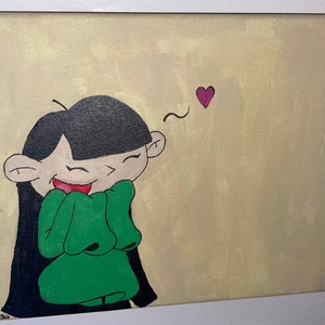 May include: A hand-painted canvas featuring a cartoon character with black hair, green clothing, and a big smile. A pink heart is floating above the character's head.