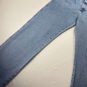 May include: A pair of light blue denim jeans with a straight leg fit.