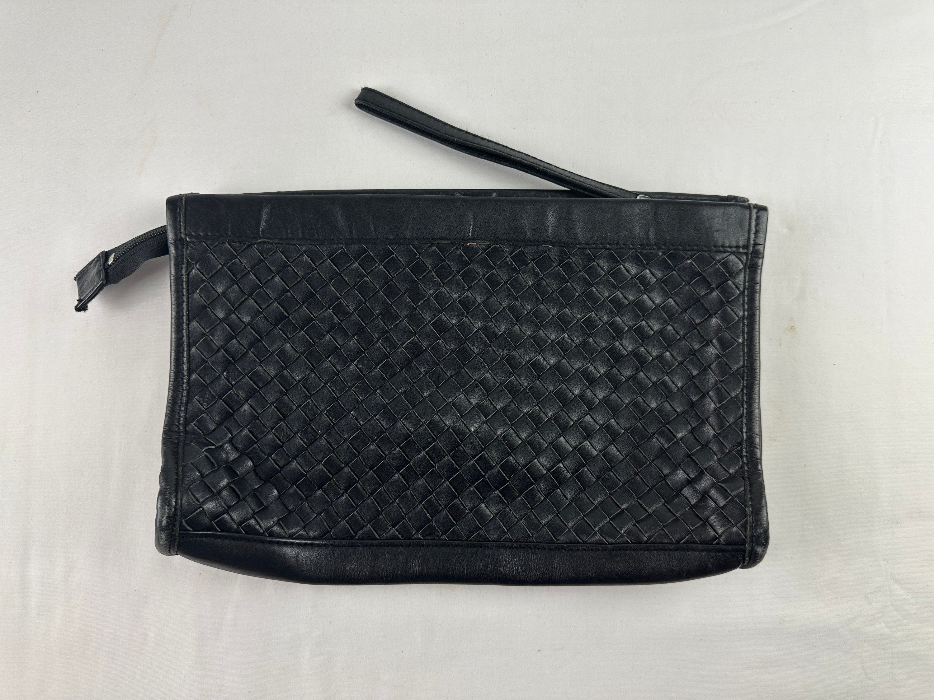 Black woven clutch bag hotsell