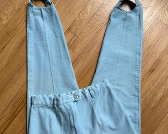 Pantalones elásticos con estribos de color azul pálido de los años 90