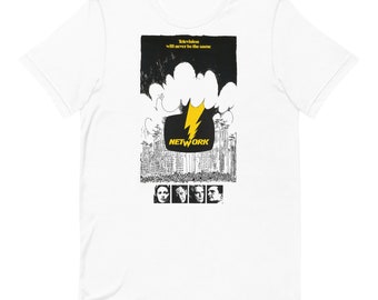 May include: White t-shirt featuring a graphic from the movie "Network." The design includes a yellow lightning bolt, the word "NETWORK," and the phrase "Television will never be the same." Below the design are four black and white portraits.