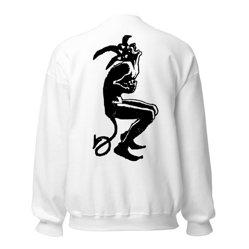 May include: White sweatshirt with a black and white illustration of a jester figure with horns and a tail. The jester is sitting down and has a distressed look on its face.